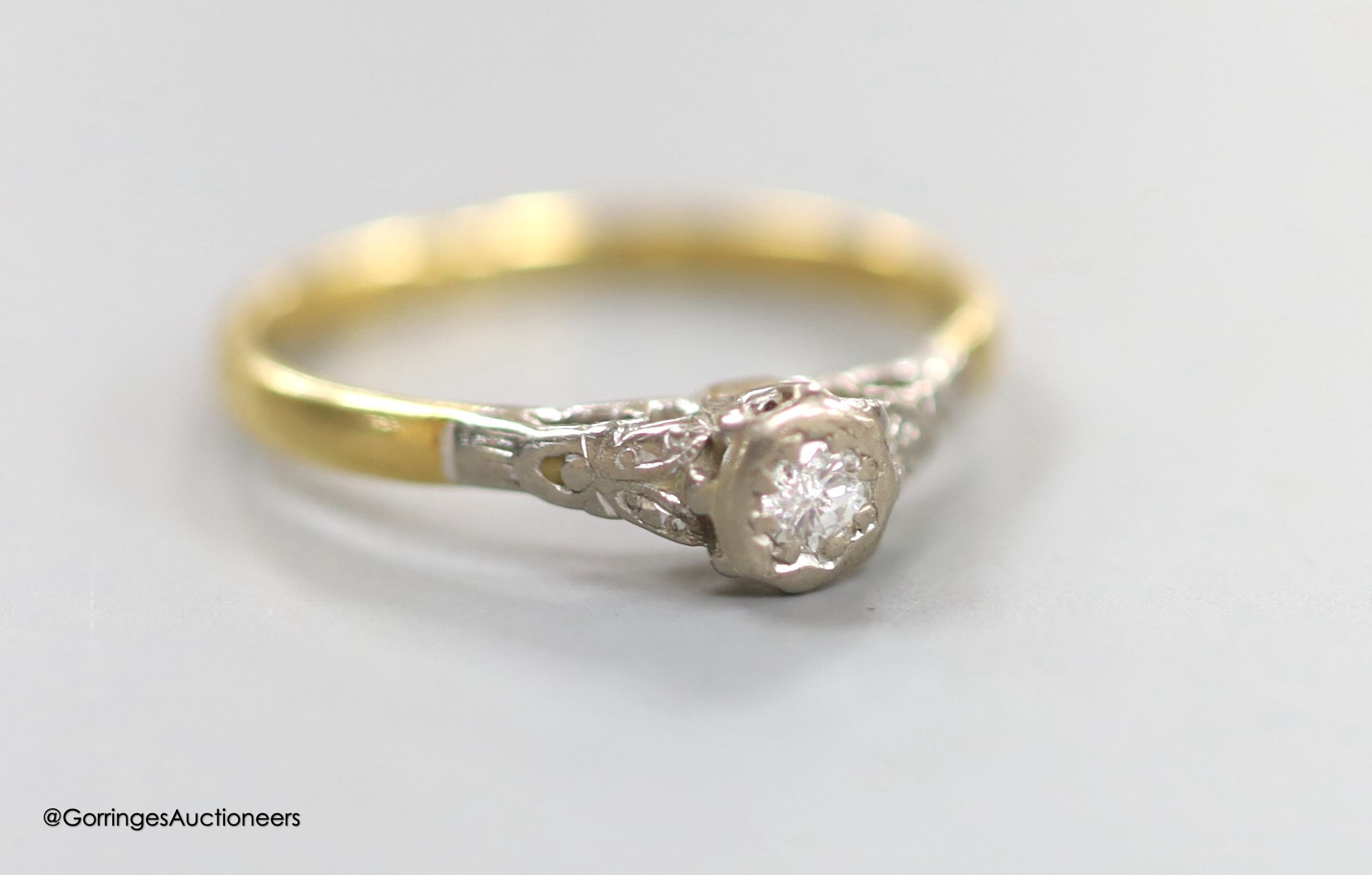 A 9ct three-colour gold bracelet, 3.6 grams and an 18ct gold partially-gem-set ring, gross 2.1 grams.